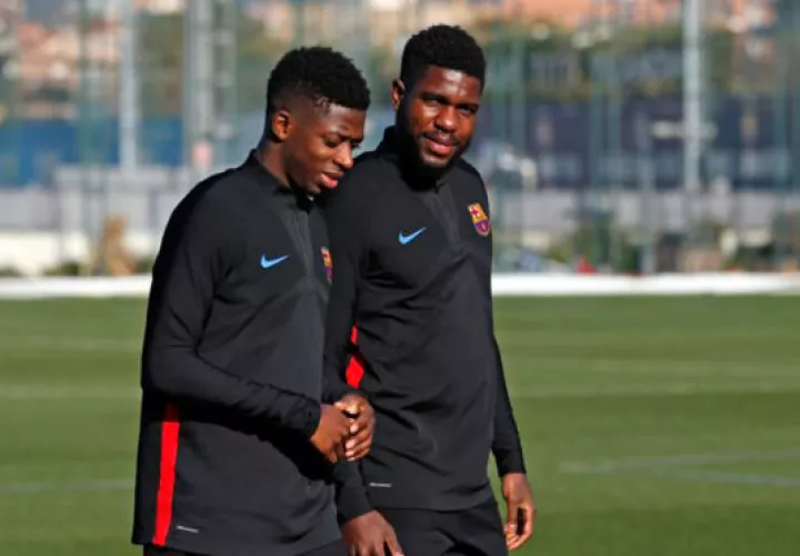 Umtiti (der.) y Dembelé. 